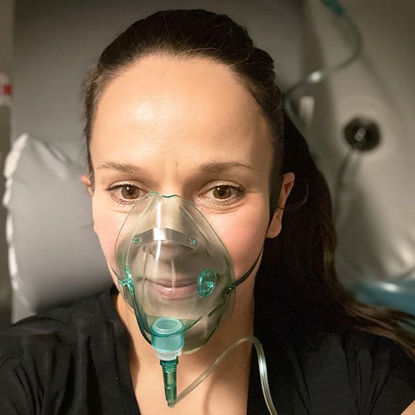 Patient in hyperbaric chamber with mask on